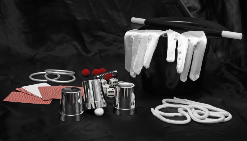 eyes, knife, cloth, focus on foreground, indoors, magic, drink, fork, food, tools, red, container, metal spiral, rope, table knife, napkin, wand, gloves