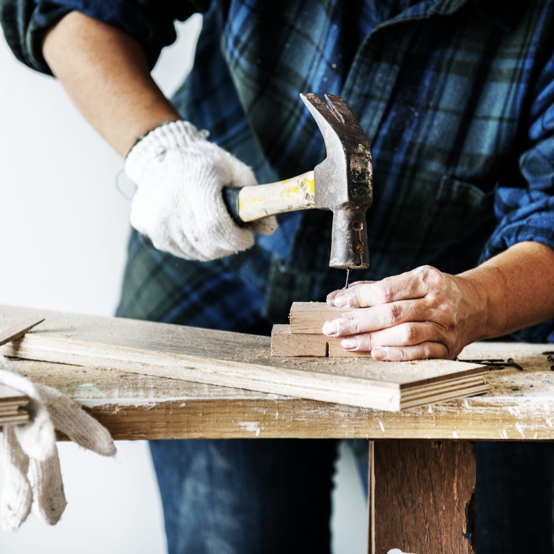block, wood - material, handyman, men, arts and crafts, hand tool, work tool, tool, holding, carpenter, indoors, occupation, midsection, workshop, real people