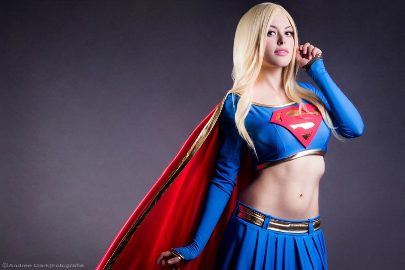 Superwoman, blonde, cosplay, Supergirl, simple background, long hair, women, Nadia Sonika, belly, skirt, looking at viewer, 720P, coats, model, open mouth