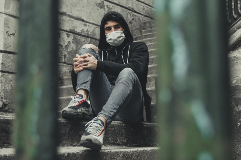 male, leisure activity, sitting, footwear, 4K, man, urban, sneaker, real people, purge, person, full length, selective focus, outdoors, clothing, pose