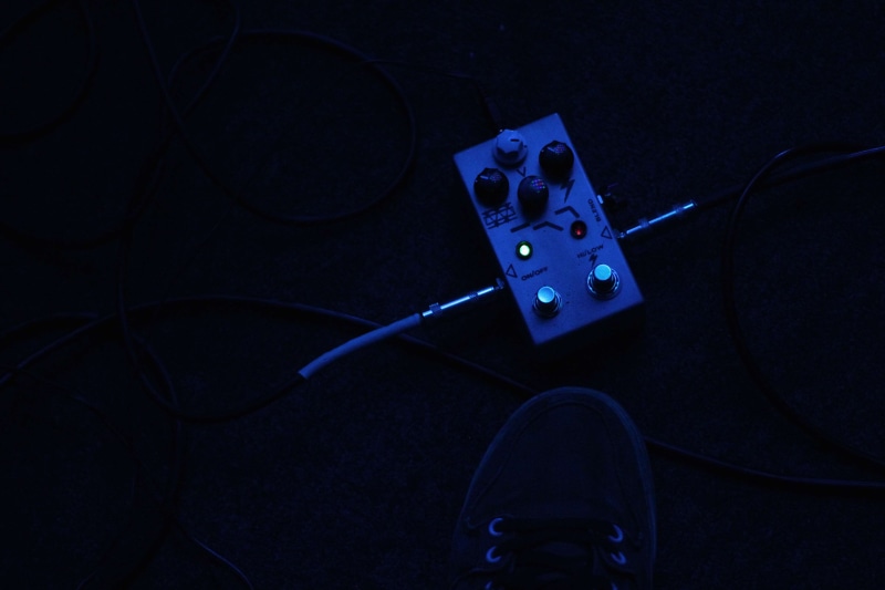 holding, pedals, studio shot, black background, technology, indie, bass, blue, distortion, music, 4K, directly above, guitar, indoors, wireless technology