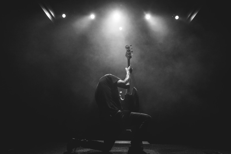 playing, adult, men, guitarist, 4K, illuminated, black and white, lead, music, arts culture and entertainment, performance, one person, artist, performing arts event