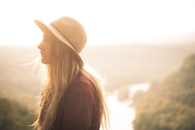 hair, rural Scene, young Adult, side view, smiling, copy Space, happiness, woman, day, lifestyles, casual Clothing, freedom, focus, women, hand, clothing