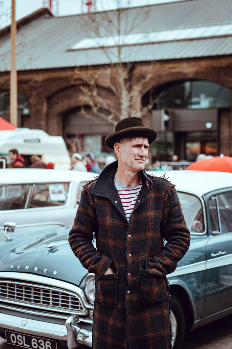 plaid, three quarter length, clothing, brown, street portrait, men, wearing, outdoors, one man only, lifestyles, transportation, 5K, coat, real people