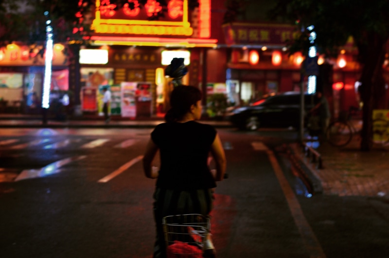 focus on foreground, architecture, one person, built structure, childhood, three quarter length, casual clothing, nightlife, guangzhou, rear view, beijing lu