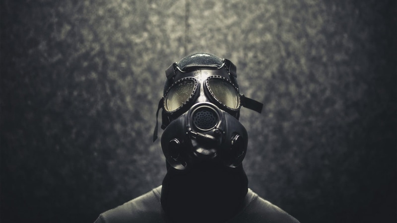 single object, gas, disguise, safety, focus on foreground, mystery, apocalyptic, mask, unrecognizable person, security, one person, headshot, black color