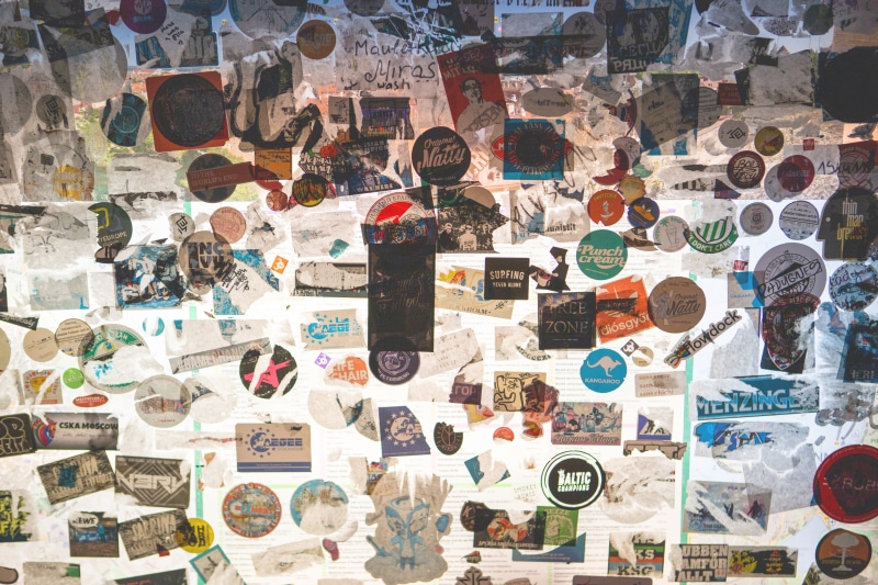 wall - building feature, market, symbol, variation, full frame, no people, stickers, communication, large group of objects, brochure, indoors, art and craft