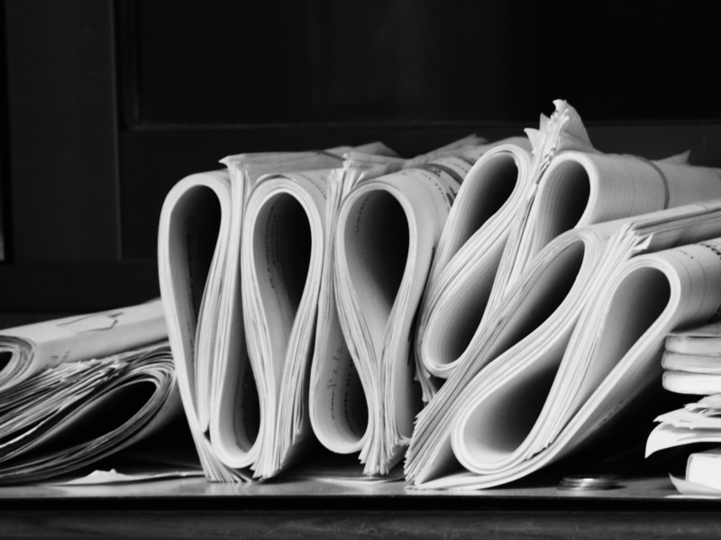 large group of objects, white, black, office, choice, work, rolls, technology, bundles, document, arrangement, lot, data, piles, equipment, indoors, wood - material