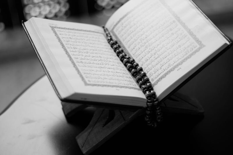 focus on foreground, holy, macro, black-and-white, islam, beads, publication, book, grayscale, open, photo, still life, no people, table, belief, religion