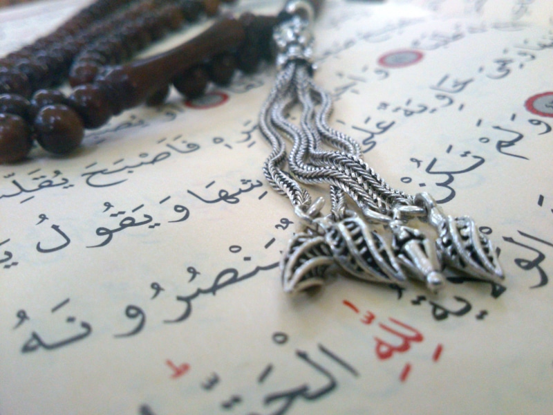 message, paper, still life, jewelry, his name, table, script, indoors, misbaha, close-up, holy quran, communication, handwriting, pen, no people, education