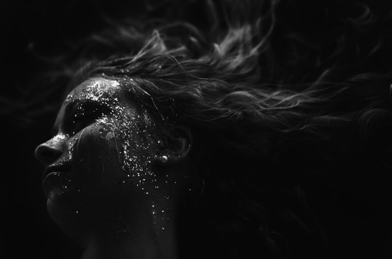 s, sparkle, smoke - physical structure, splat, motion, portrait, person, activity, long hair, water, serious, blonde, dark, headshot, human body part, black background