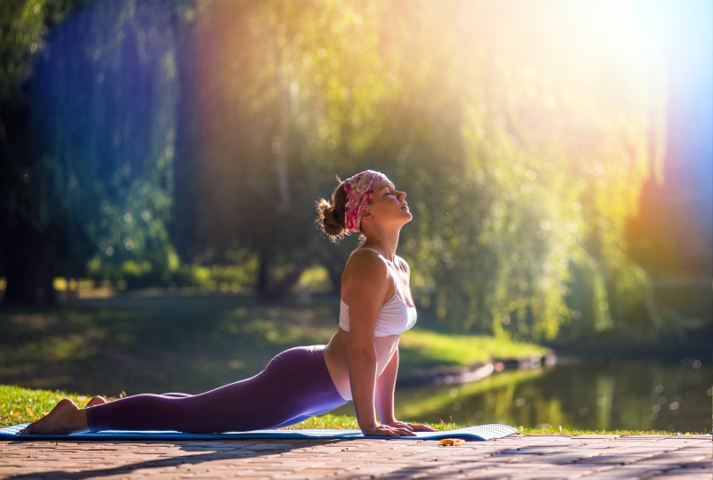 park - Man Made Space, water, outdoors, relaxation Exercise, relaxation, yoga, sweatpants, concentration, side view, sunlight, people, lifestyles, sport