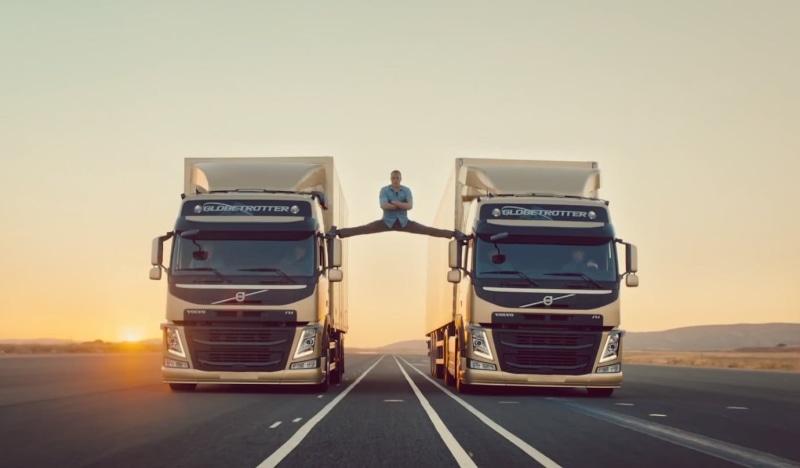 Jean-Claude Van Damme, Scania, full length, arms on chest, asphalt, copy space, 720P, travel, box, commercial, gray, splits, standing, stretching, outdoors