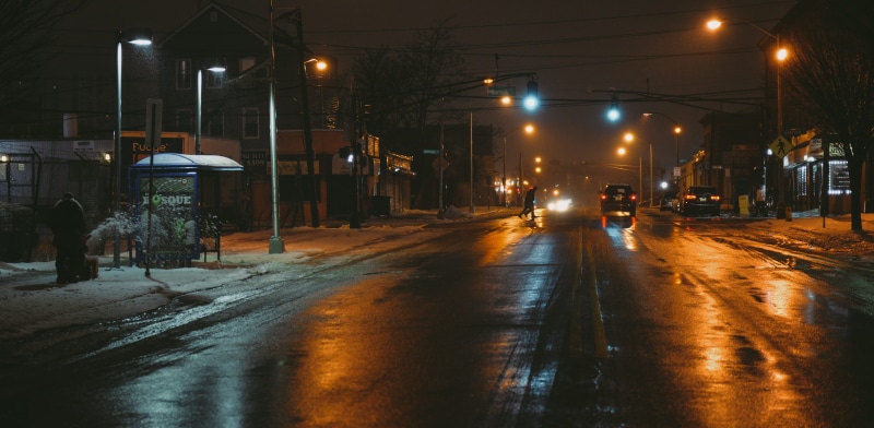 road, town, city street, car, rainy season, transportation, urban, person, asphalt, intersection, street light, architecture, highway, built structure
