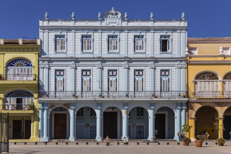 person, housing, incidental people, cuba, window, havana, men, the past, door, group of people, pillar, road, day, architecture, outdoors, built structure