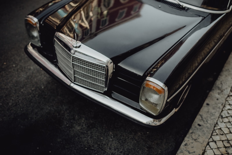 motor vehicle, vintage, vintage car, benz, high angle view, land vehicle, black car, 5K, portuguese, automobile, focus on foreground, arts culture and entertainment