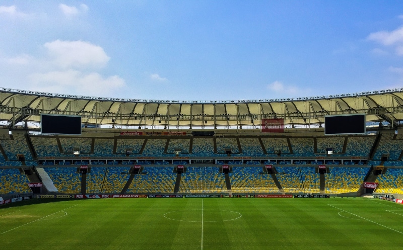 stadium, green, no people, football, cup, field, playing field, arena, day, clouds, team sport, sky, sport, green color, game, nature, cloud - sky, grandstand