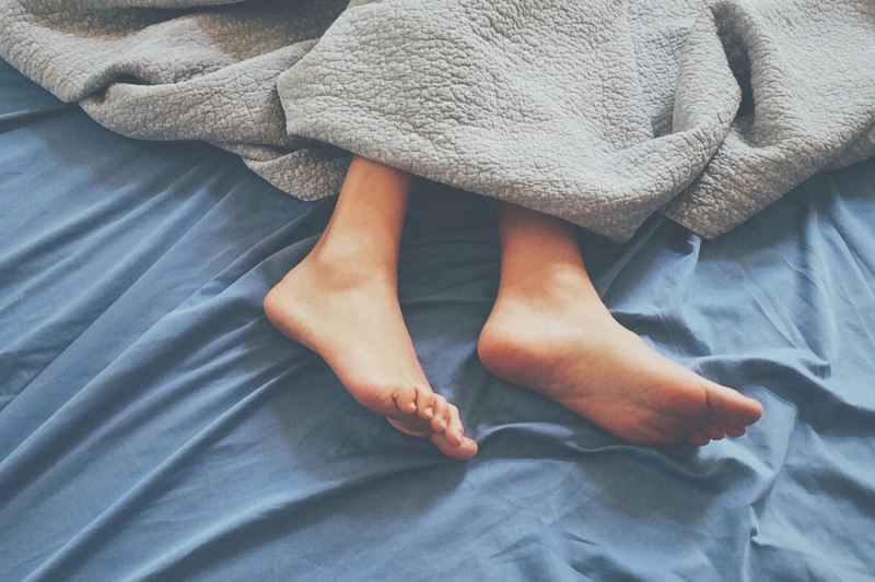 lifestyles, body part, sheet, bedroom, home, barefoot, linen, women, sleeping in, people, human body part, textile, house, blanket, high angle view, furniture
