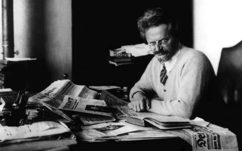 historic, newspaper, paper, real people, book, reading, books, men, sitting, one person, 2K, waist up, men with glasses, males, publication, mature adult