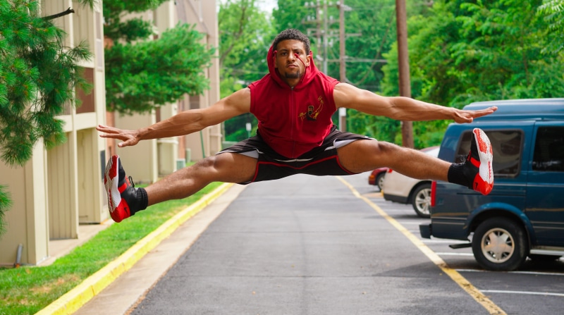effort, man, lot, shorts, fashion, healthy, daytime, jump, sport, body part, human limb, daylight, person, athlete, arms outstretched, clothing, pathway