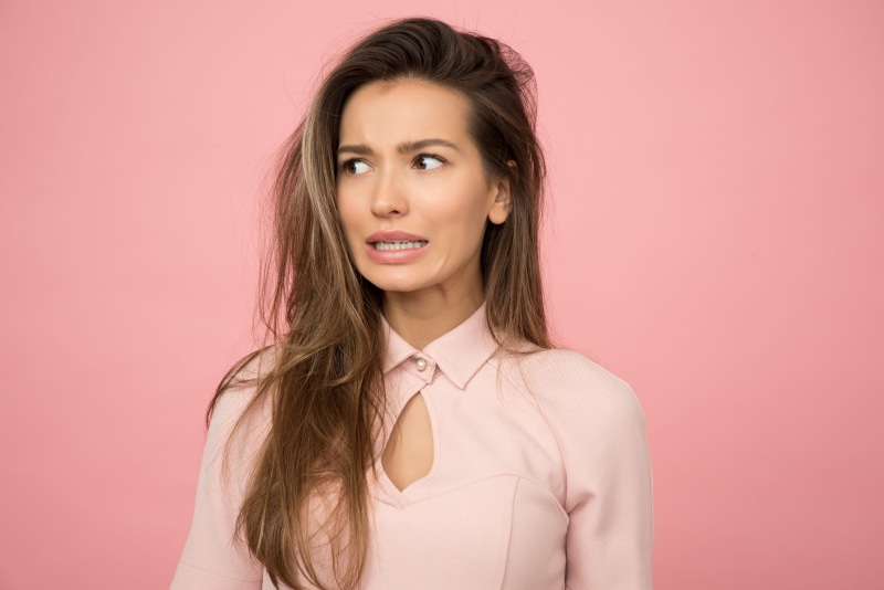 female, looking, glamour, unsure, human face, woman, casual, young adult, young, colored background, elegant, pretty, joy, 5K, pink color, indoors, photoshoot