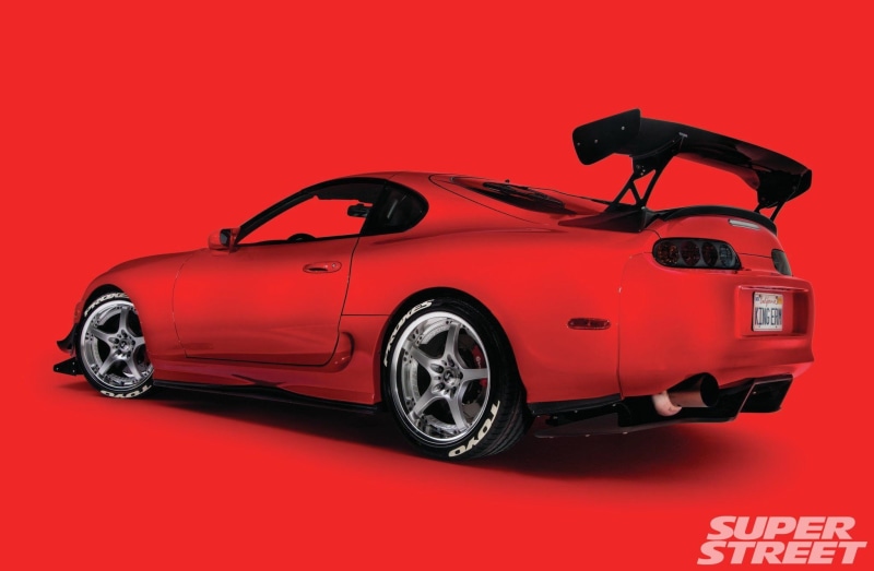 indoors, speed, land vehicle, shiny, people, luxury, wealth, colored background, cut out, wheel, mode of transportation, sports car, chrome, red background