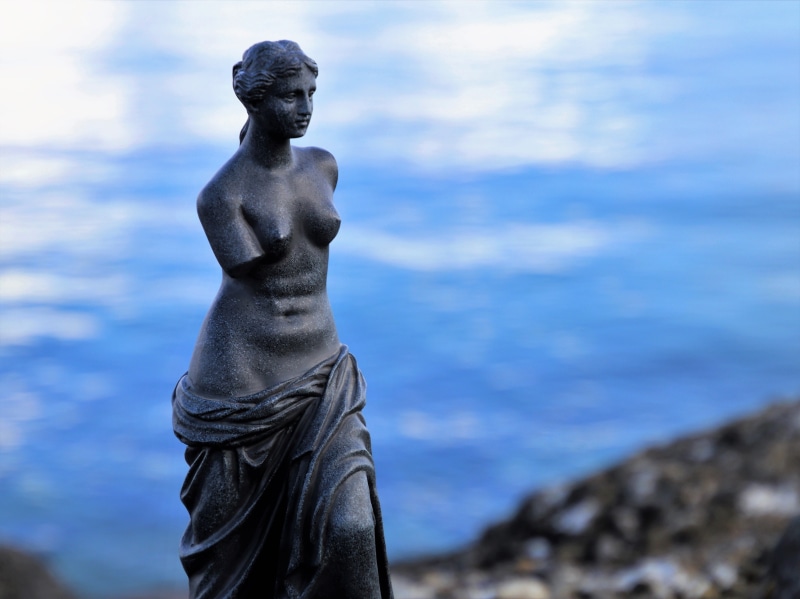 sunlight, pattern, focus on foreground, blue, male likeness, antique, thinking, stone, profile, the silence, view, decoration, meditation, outdoors, woman