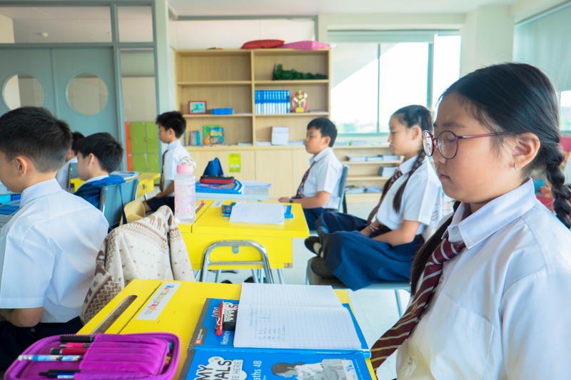 uniform, females, standing, yellow, chair, women, children, teacher, student, boys, accessory, men, real people, eyeglasses, education, school, accessories