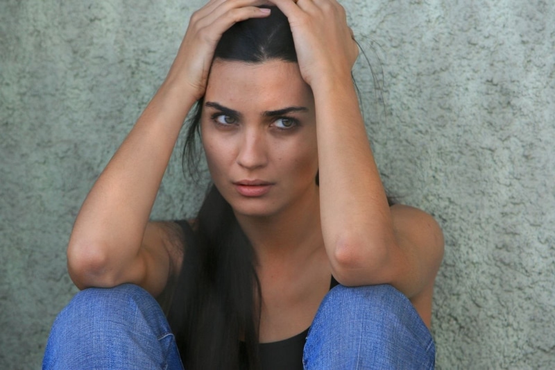 front view, anxiety, head in hands, emotion, women outdoors, model, young adult, worried, sadness, hopelessness, frustration, adult, emotional stress, Tuba Büyüküstün