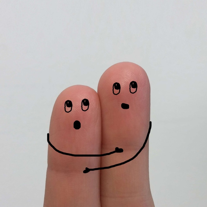 drawing, emotion, anthropomorphic face, hug, art and craft, face, studio shot, body part, fear, close-up, fingers, human representation, indoors, voltage