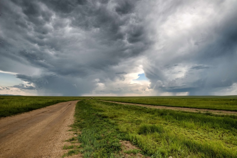 beauty in nature, a step, outdoors, grass, no people, meadow, field, horizon over land, road, dirt road, horizon, landscape, cloud - sky, anxiety, scenics - nature
