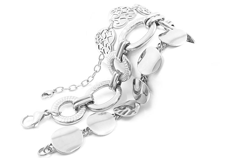 indoors, brightness, pendant, joy, shiny, merchandise, punk, jeweler, hand, commercial, purchase, luxury, trade, sparkle, gift, bracelet, white color, gemstone