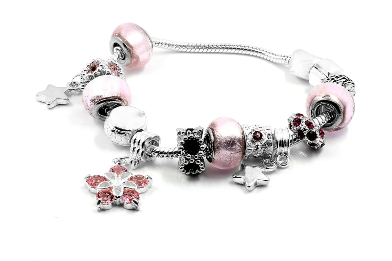 2K, punk, indoors, close-up, personal Accessory, merchandise, commercial, pleasure, jeweler, hand, shiny, white background, joy, fashion, precious gem