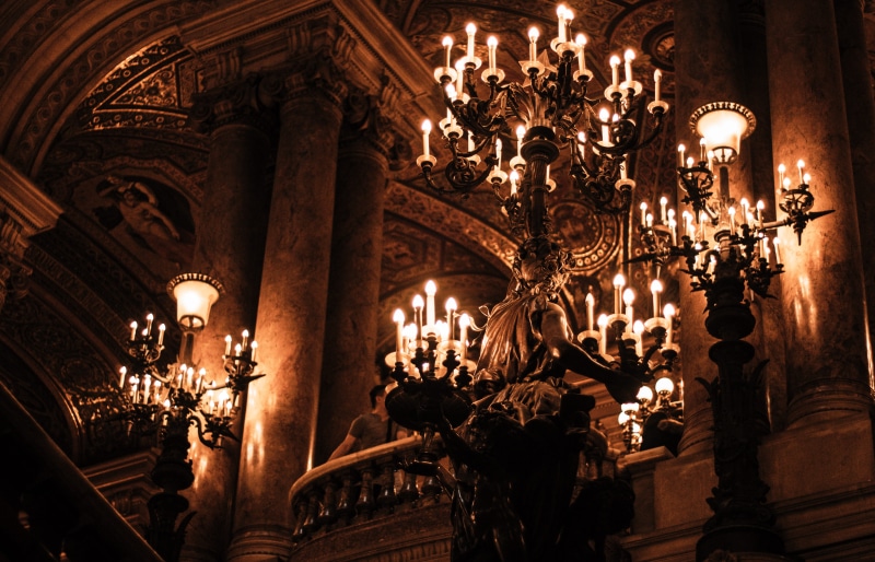 low angle view, luxury, warm, light, built structure, sconces, electric lamp, 5K, illuminated, dark, architectural column, theatre, ornate, decoration