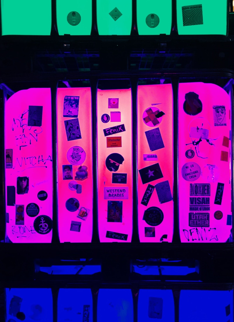 indoors, poster, 2K, close-up, no people, flyer, number, in a row, assorted, machinery, trophy, technology, word, logo, communication, color, music, projection screen