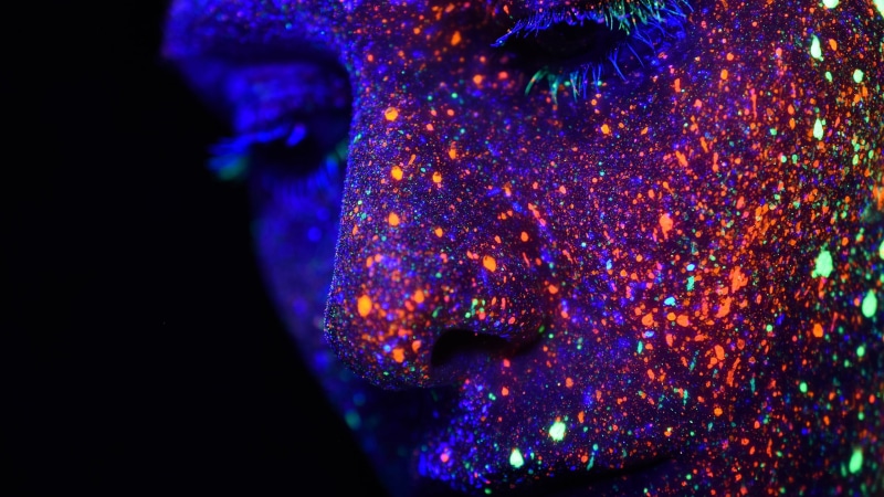 neon, paint splatter, futuristic, close-up, glowing, shiny, pattern, photography, body paint, body part, studio shot, creativity, abstract, nose, night