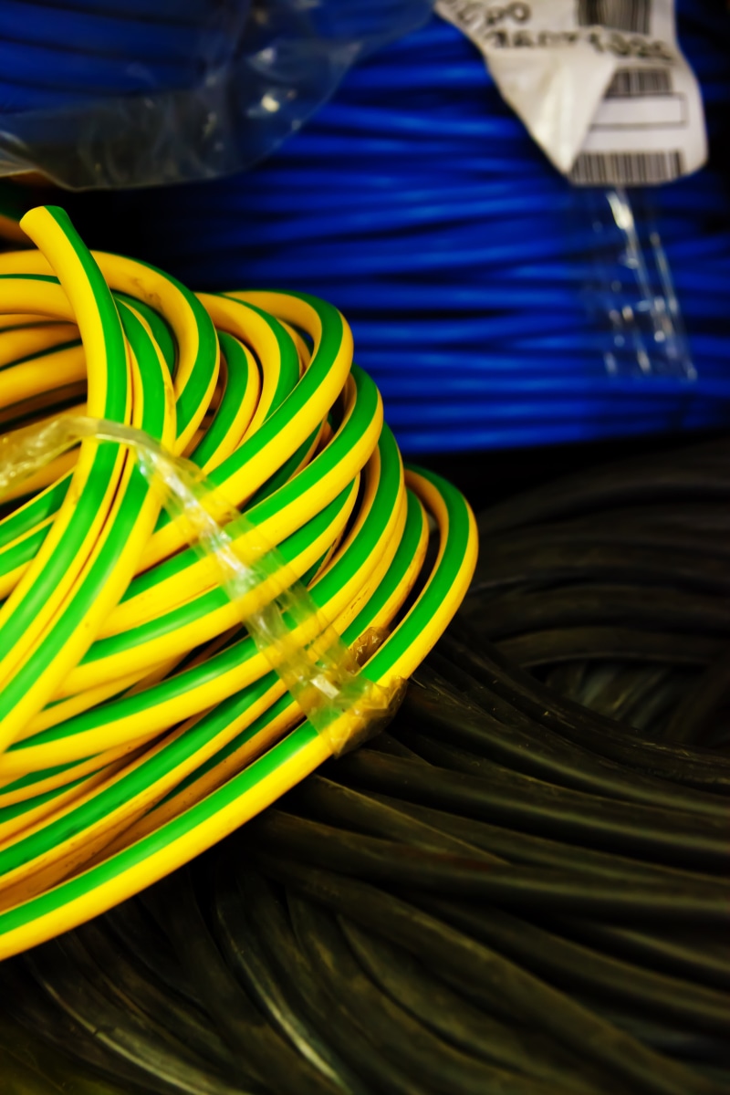 large group of objects, wire, electricity, technology, indoors, black, power, high, computer Network, high angle view, close-up, cables, scroll, telecommunications Equipment
