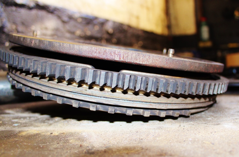 focus on foreground, wheel, no people, old, weathered, spare parts, art and craft, silver colored, selective focus, sunlight, wood - material, metal, 4K