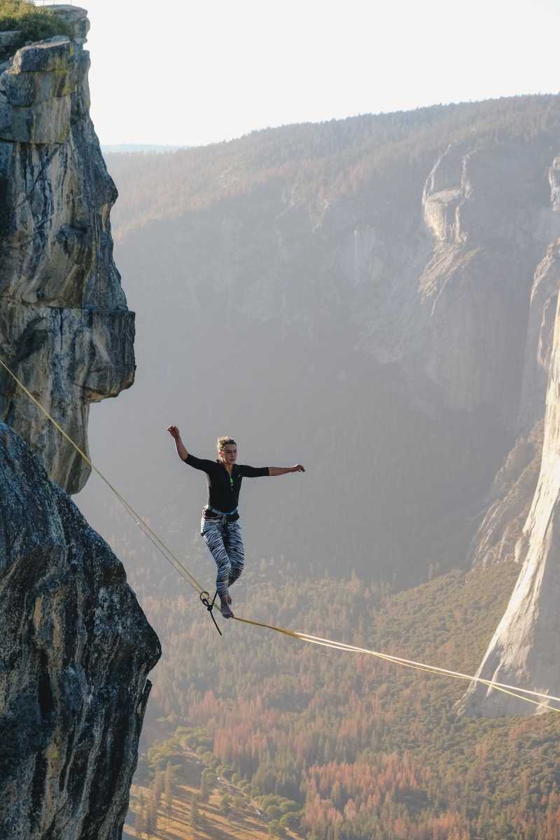 extreme, human arm, height, balancing, skill, rock - object, brave, concentration, lifestyles, cliff, risk, mountain, real people, one person, walking