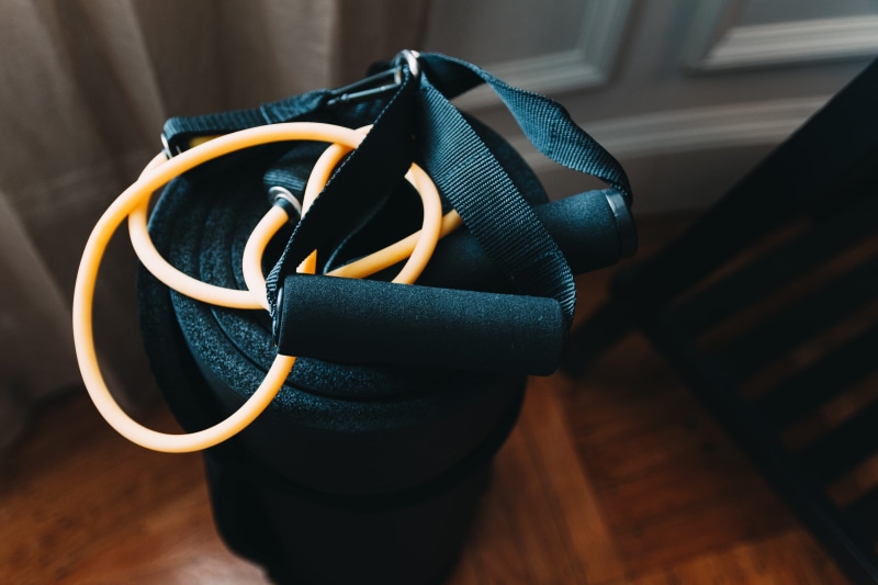 band, home interior, day, wood - material, shallow, wood, indoors, man made object, focus on foreground, mat, clothing, backpack, resistance, photography