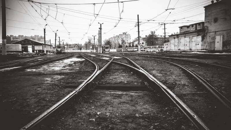 outdoors, vanishing point, transportation system, transport, 5K, tracks, black and-white, wagon, day, building, line, street, urban, building exterior