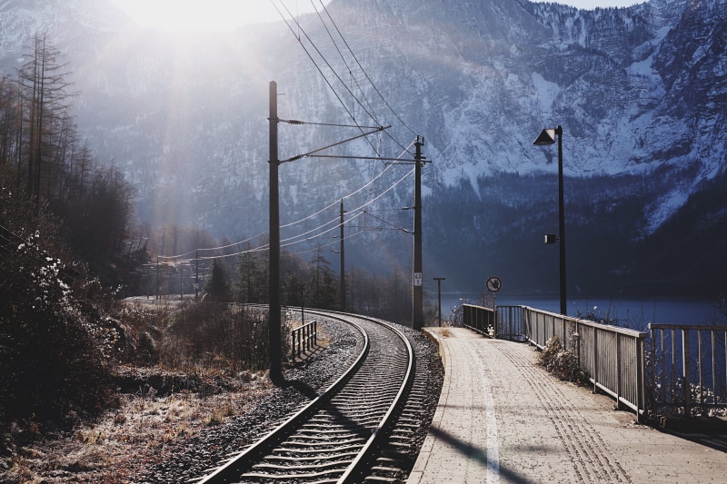 rail transportation, walkway, sun, path, dirt road, train, connection, power supply, road, track, plant, sunlight, the way forward, highway, train station