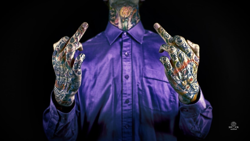 studio shot, adult, standing, chest, leisure activity, men, indoors, dress, clothing, one person, tattoo, black background, button, lifestyles, purple