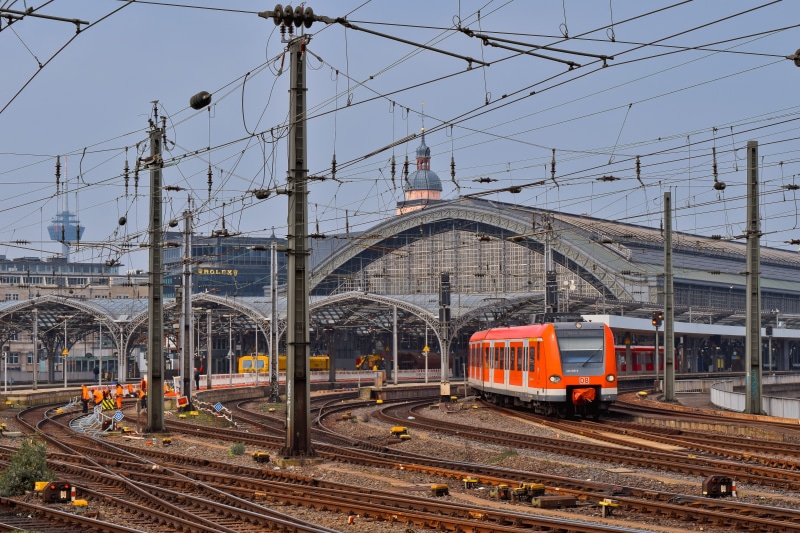 power line, transportation, railroad track, construction, cologne, s bahn, train, rail transportation, architecture, railway station, day, steel, building exterior