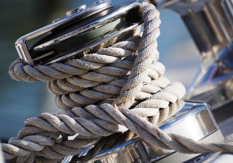 outdoors, tied knot, pulley, nature, node, close-up, strength, twisted, mode of transportation, sunlight, durability, no people, sailboat, connection, wooden post