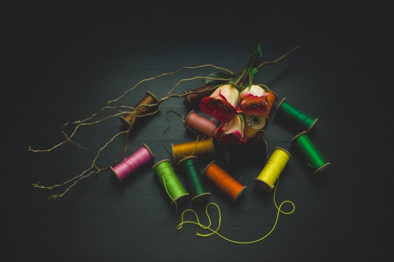 still life, thread, table, lay, sewing item, multi colored, photography, art and craft, high angle view, black background, textile, sewing thread, silk