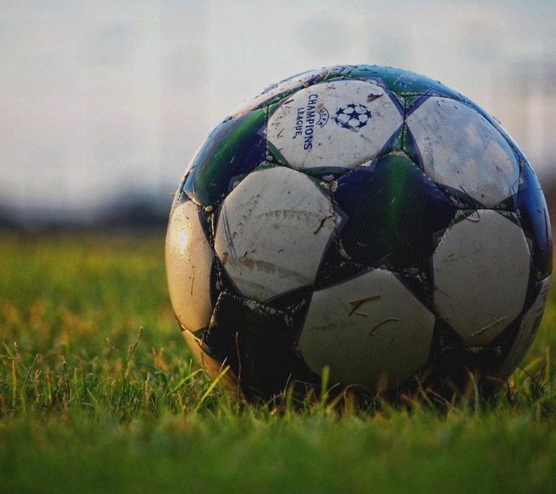 broken, single object, day, no people, land, soccer ball, nature, ball, sports equipment, plant, close-up, 480P, sphere, grass, green color, team sport