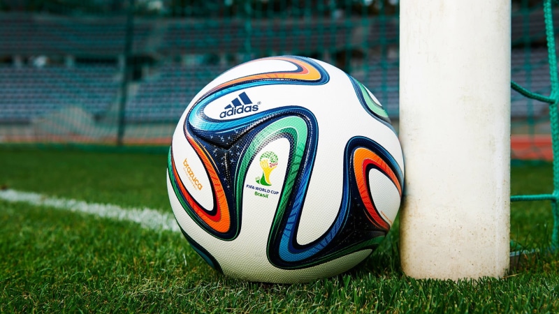 balls, number, field, sport, adidas, multicolored, green color, nature, focus on foreground, playing field, no people, FIFA World Cup, shoe, ball, plant