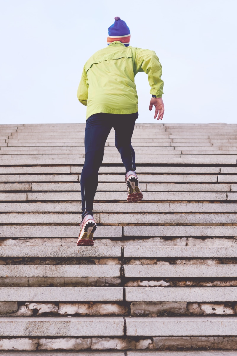 sky, exercise, outdoors, active wear, built structure, staircase, wood - material, women, steps and staircases, hood - clothing, person, runner, workout