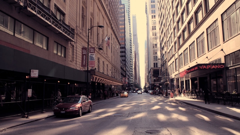 building exterior, asphalt, gray, city life, mode of transportation, residential district, road, the way forward, direction, people, day, incidental people
